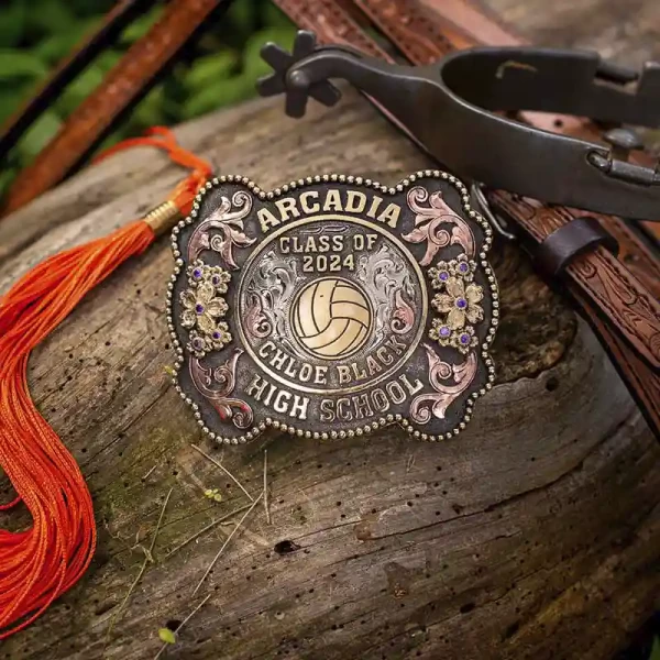 A custom graduation belt buckle for Arcadia High School with personalized name featuring a volley ball figure